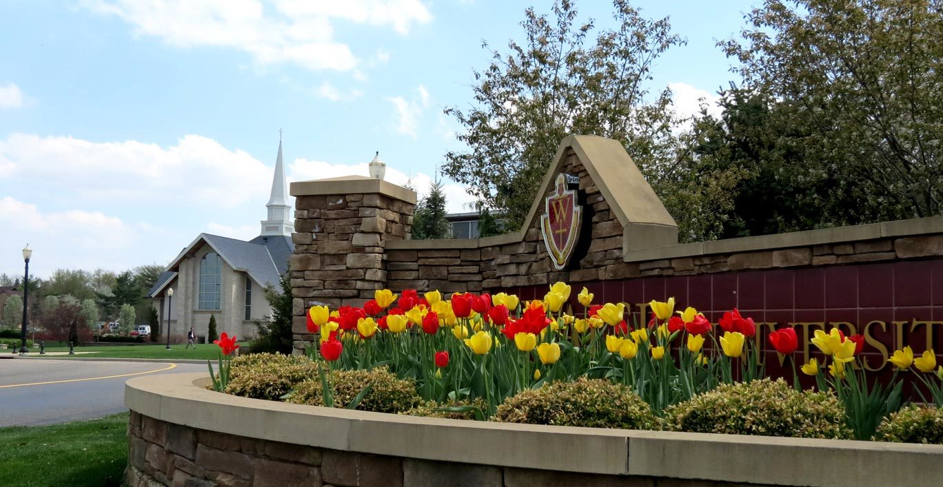 photo of Walsh University's entry sign at the corner of Founder's Drive and East Maple Street